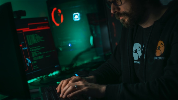 Man Coding in dark