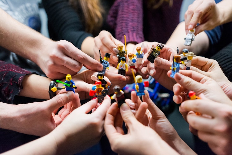 Hands holding Lego figures. jpg