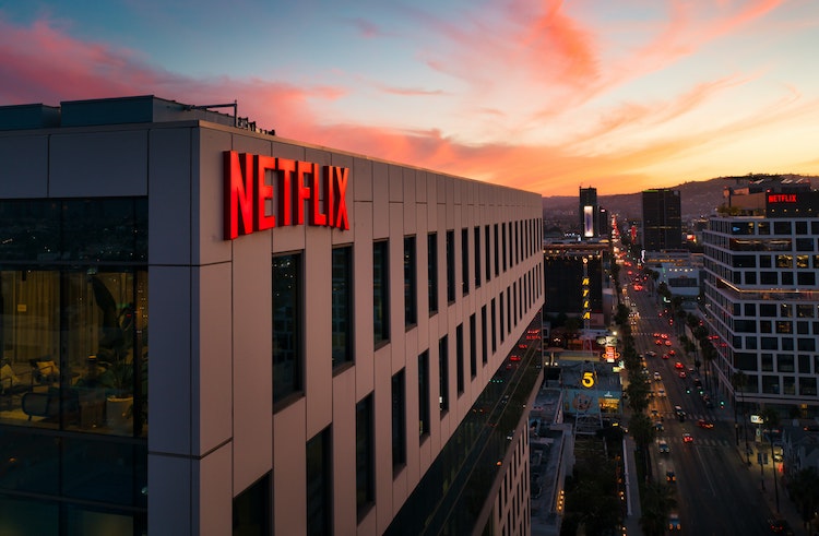 Building at sunset with large Netflix sign on it