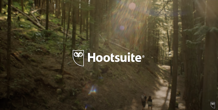 Still from PR Video for Hootsuite showing logo on trees background
