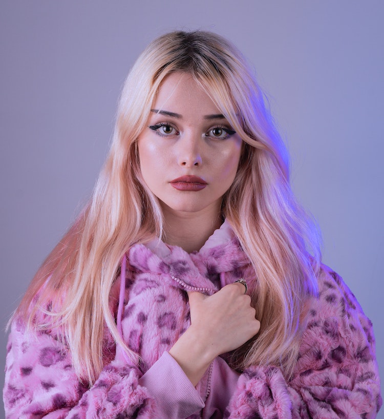 Blonde girl in lilac jacket