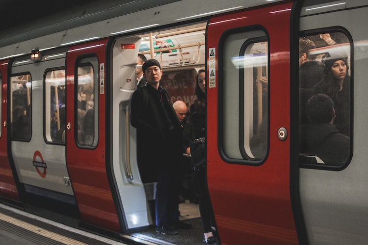 Man looks out of underground train door