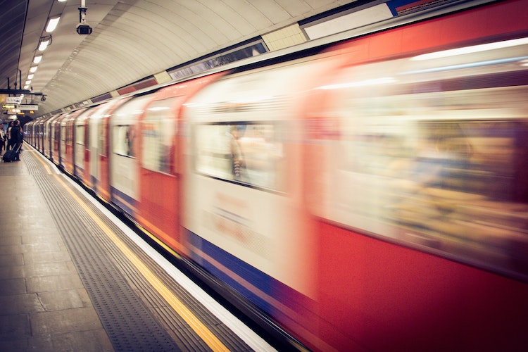 Speeding London Underground train at station