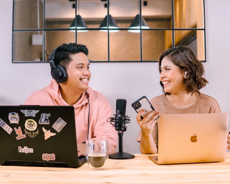 Man and woman doing a PR podcast